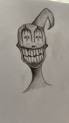 a drawing of a creepy clown's head with an evil smile on his face