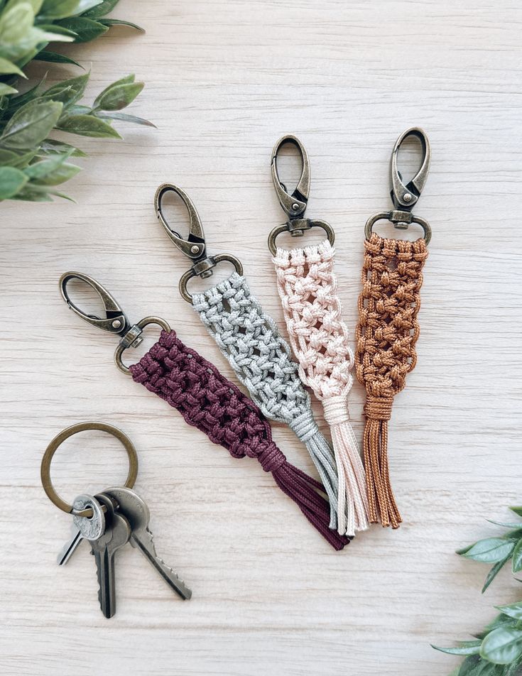 four crocheted key fobs on a table