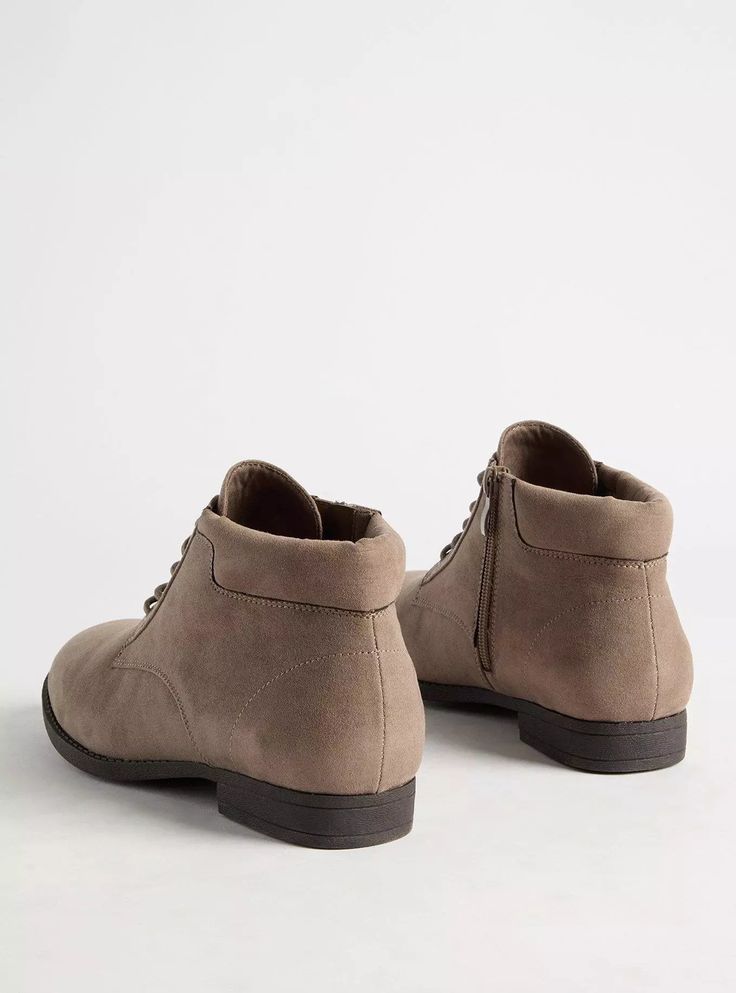 Opt for comfort and style with our faux suede boots that have a lace-up front and a side zipper. Our unique fit gives you extra wide width and extra room around your whole foot. EXTRA WIDE WIDTH (WW). Lace-up front. Side zipper. Almond toe. 1” heel. Extra cushioned footbed; textured outsole. Man-made material. Imported wide width shoes. The best plus size women's lace-up bootie (ww) booties in dark taupe made of pleather. Rock your look from Torrid to Festivals like Coachella and Lollapalooza, a concert, a show, or just for fun! Torrid is your destination for cozy fall and winter clothes to keep you warm and comfortable. New Street Style, Faux Suede Boots, Unique Fits, Wide Width Shoes, Fitted Wedding Dress, Dark Taupe, Swimming Outfit, Shopping Day, Extra Room