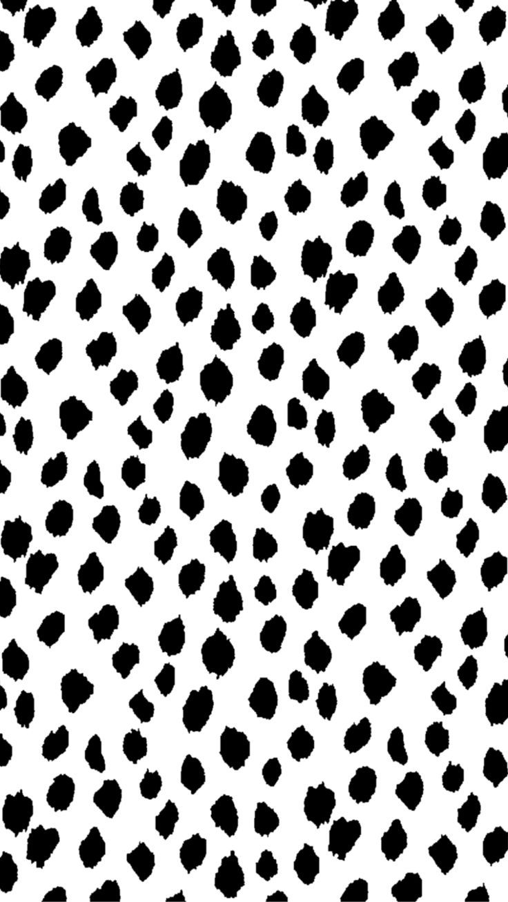 a black and white pattern with spots