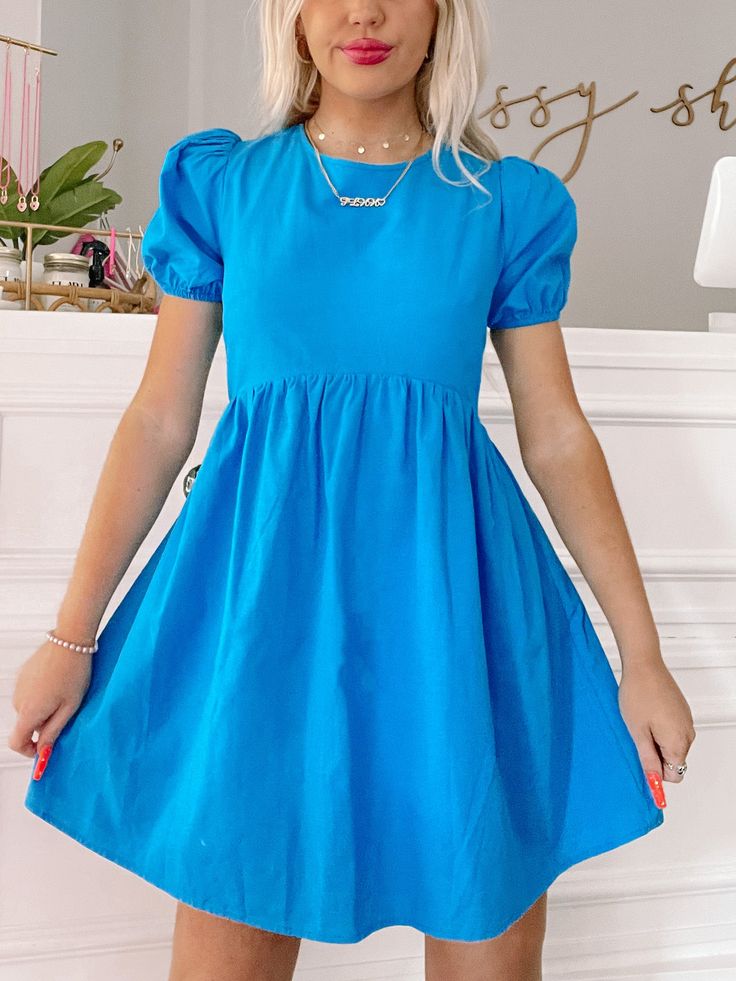 Our Over the Wave Dress is an electric blue beauty featuring puff sleeves, and an open tie back. Model is wearing a size small. Lined. content: 65% cotton, 35% linen Neon Blue Dress, Blue Spring Dress, Blue Spring Dresses, Electric Blue Dress, Vestidos Para Baby Shower, Wave Dress, Electric Blue Dresses, Sassy Shortcake, Bright Blue Dresses