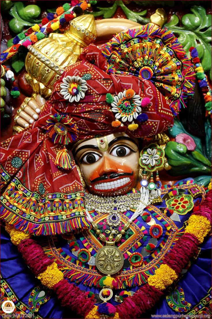 an elaborately decorated mask is displayed for sale