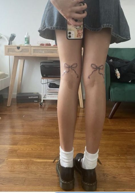 the legs of a woman with tattoos on them