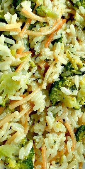 broccoli and rice salad with carrots on a white plate, ready to be eaten