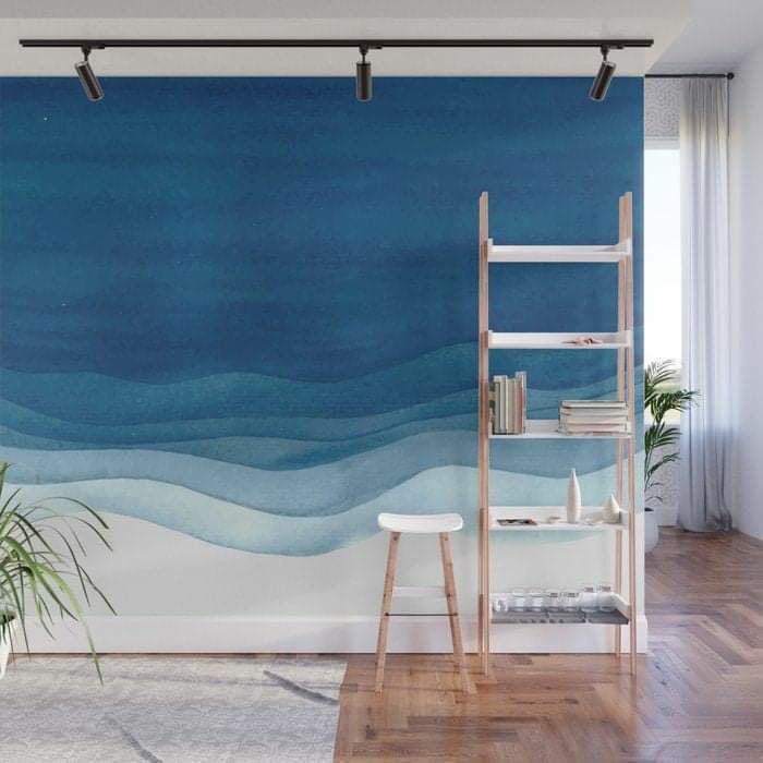 an ocean scene with waves and blue sky wall mural