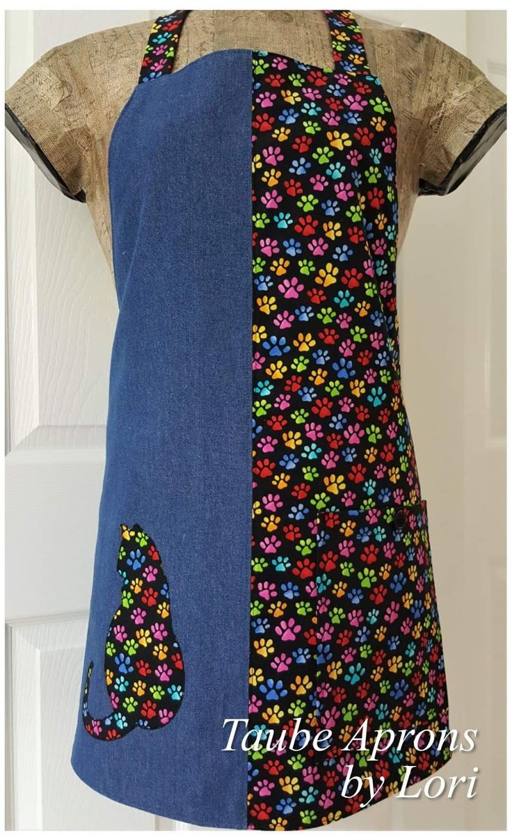 an apron made out of denim with colorful flowers on it