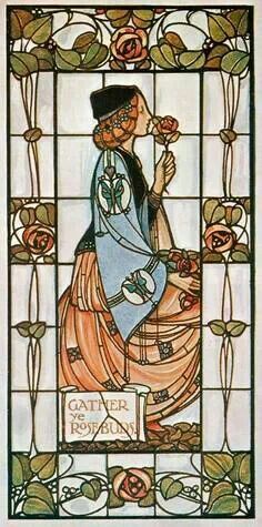 a stained glass window with a woman holding a rose in it's hand and wearing a hat