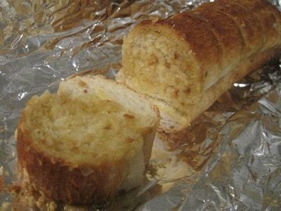 two pieces of bread sitting on top of foil