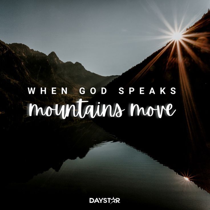 the words when god speaks mountains move in front of a mountain lake and sunburst