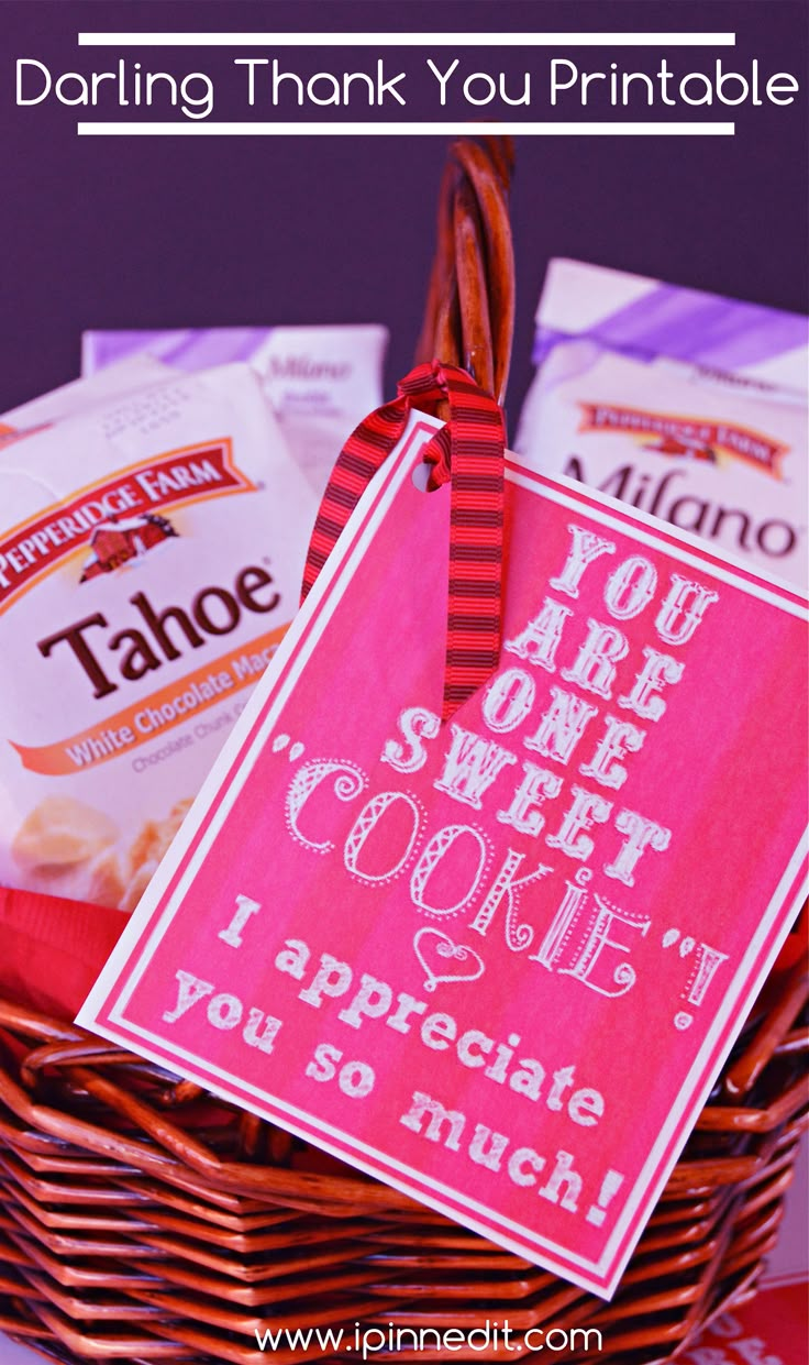 a basket filled with cookies and candy next to a sign that says, you are sweet i appreciate you so much