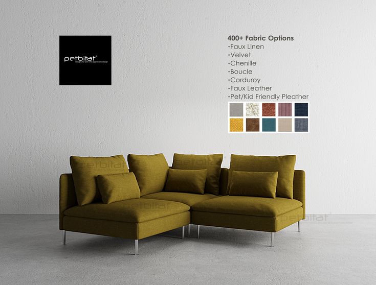 a couch sitting in front of a white wall with different color swatches on it