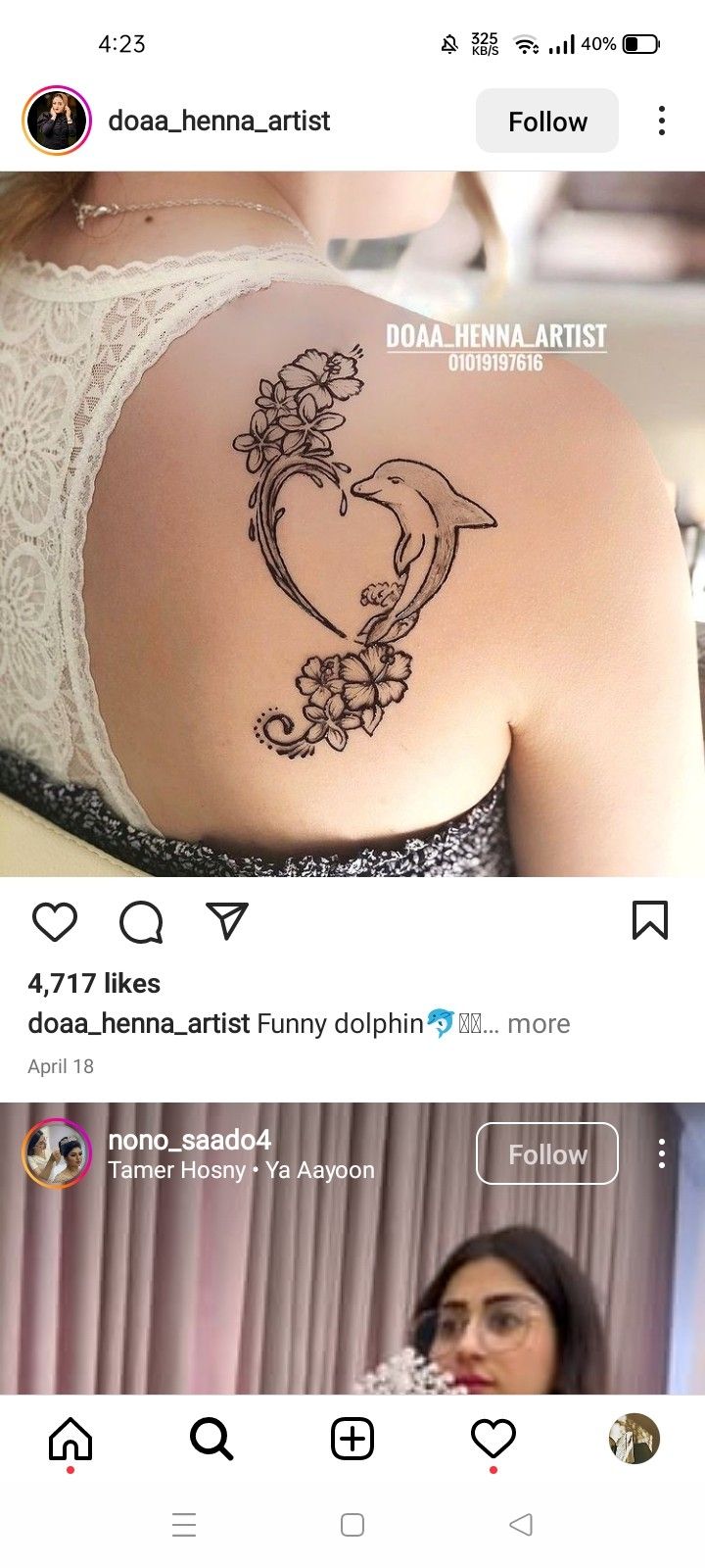 the back of a woman's shoulder with flowers on it and an image of a bird