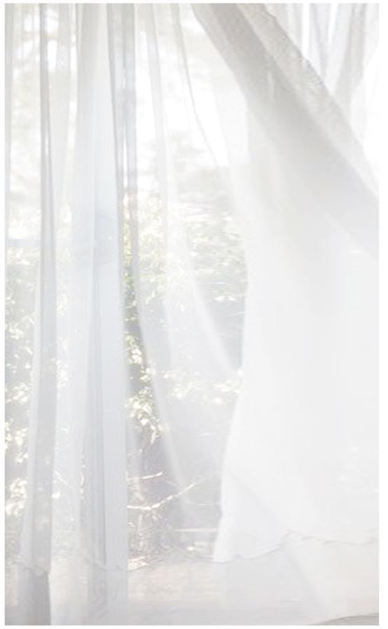 an open window with white curtains and sunlight coming through it