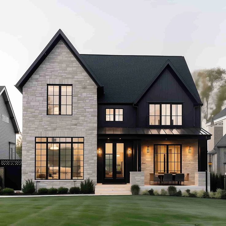 a large white brick house with lots of windows on the front and side of it