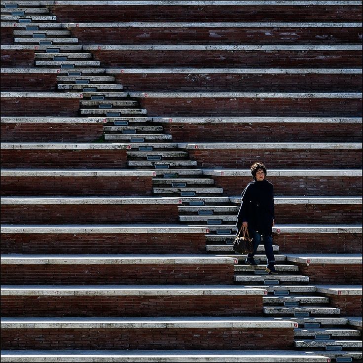 a person walking up some steps with bags