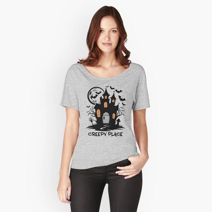 a woman wearing a grey t - shirt that says creepy place with a house on it