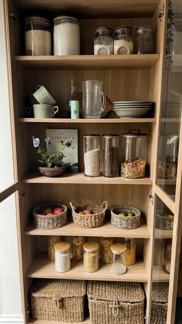 an open cupboard filled with lots of food