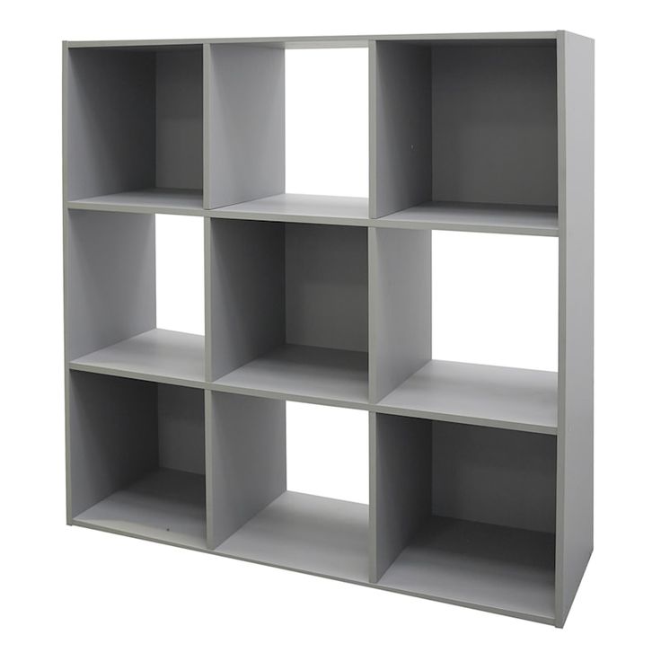 a white book shelf with six shelves on each side