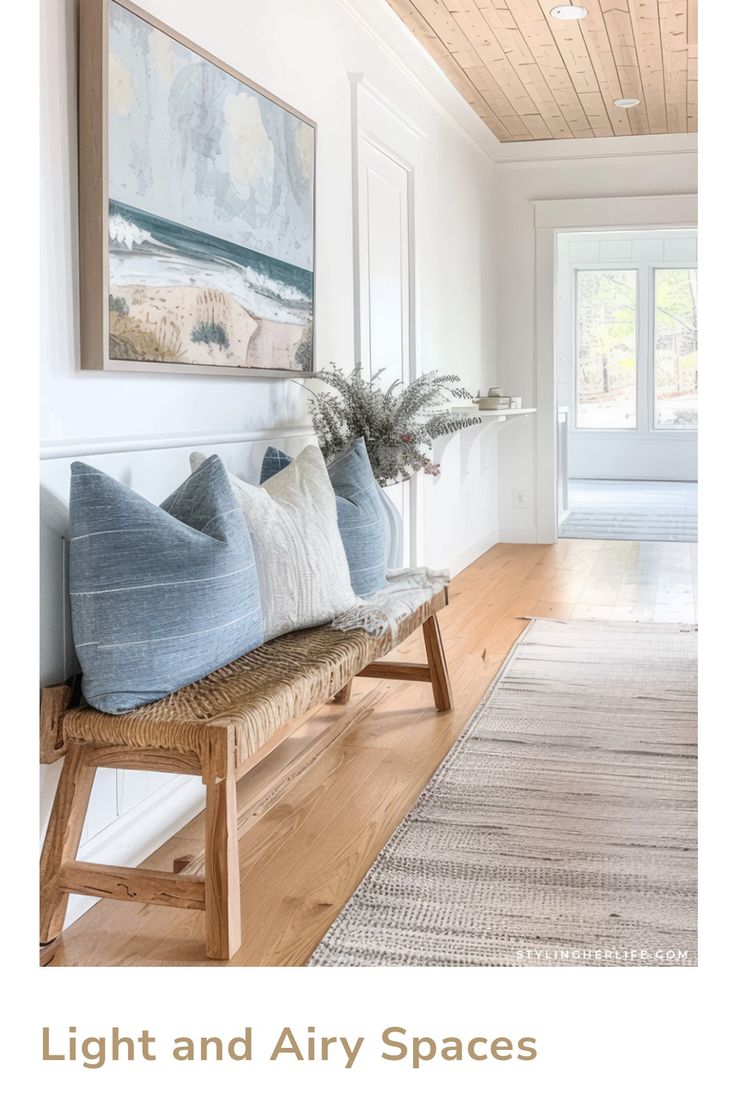 a living room with white walls and wood flooring is featured in the article light and airy spaces