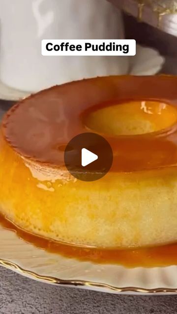 two donuts on a plate with caramel sauce drizzled over them