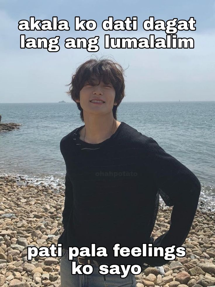 a young man standing on top of a rocky beach next to the ocean with words above him