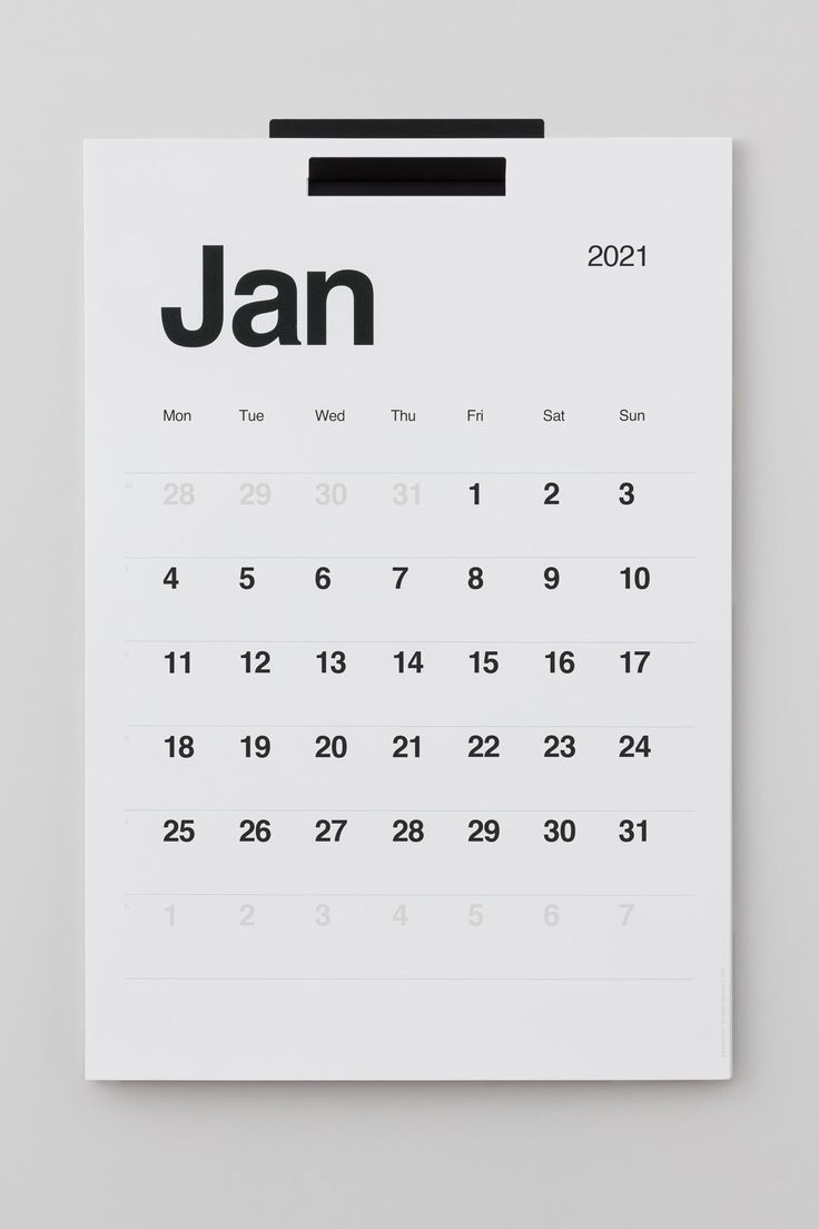 a white calendar with the word jan on it's front page, in black and white