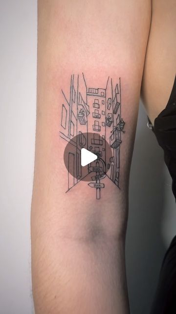 a person with a small tattoo on their arm