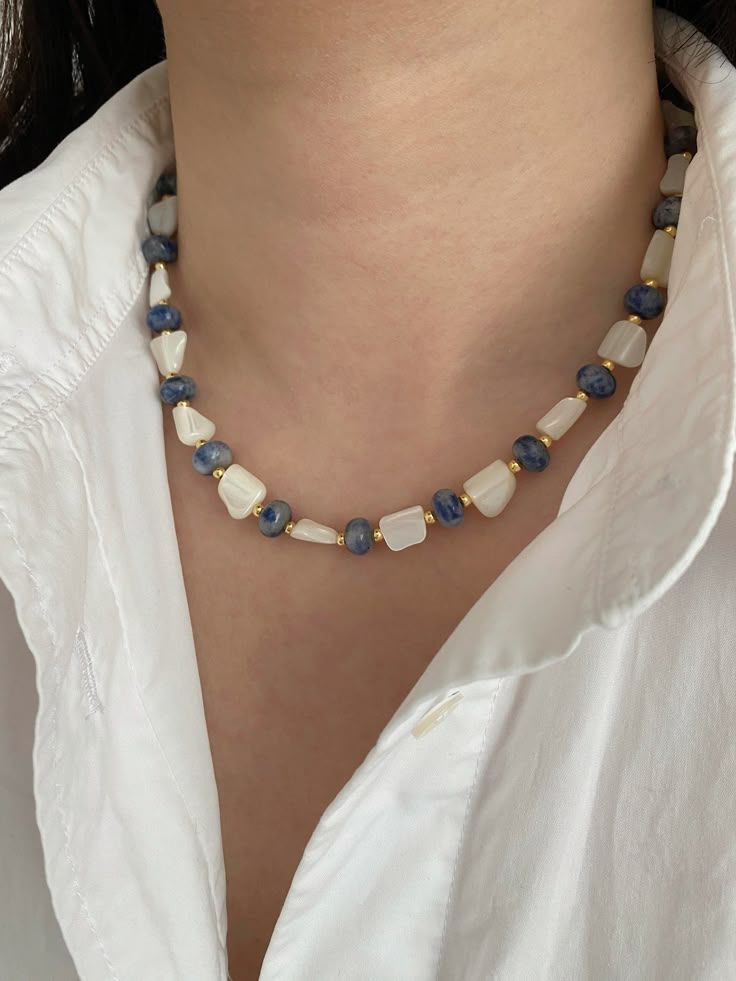 Wrap yourself in the tranquil energy of our handmade Blue Dot Jade Necklace, a unique masterpiece adorned with natural shell beads and gold-plated round beads. Each bead, measuring 8*4mm, is carefully selected to showcase the beauty of Blue Dot Jade, capturing a nature-inspired, chic, and dynamic style that's perfect for all occasions. 💙 Benefits and Birthstone Information: Blue Dot Jade is revered for its calming properties, believed to soothe the mind and promote inner peace. As a birthstone Natural Stone Shell Necklace With Round Beads As Gift, Holiday Accessories, Beads Ideas, Jade Gemstone, Natural Stones Necklace, Size Difference, Natural Stone Jewelry, Jade Necklace, Beads Handmade