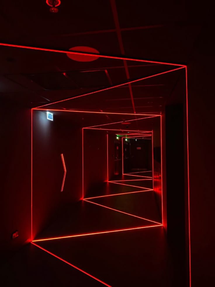 an empty room with red lights in it