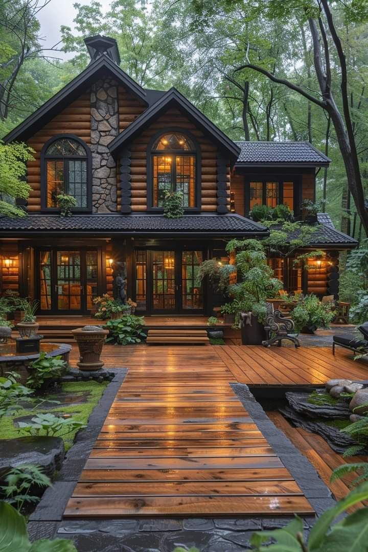 a large wooden house surrounded by trees and plants