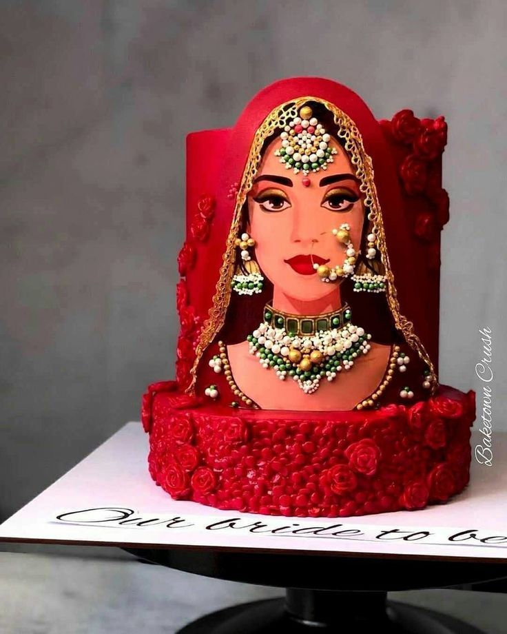 a red cake with a woman's face on it