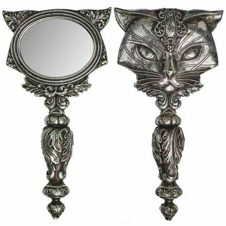 two mirrors with cats'heads on them and one has a mirror in the shape of a cat