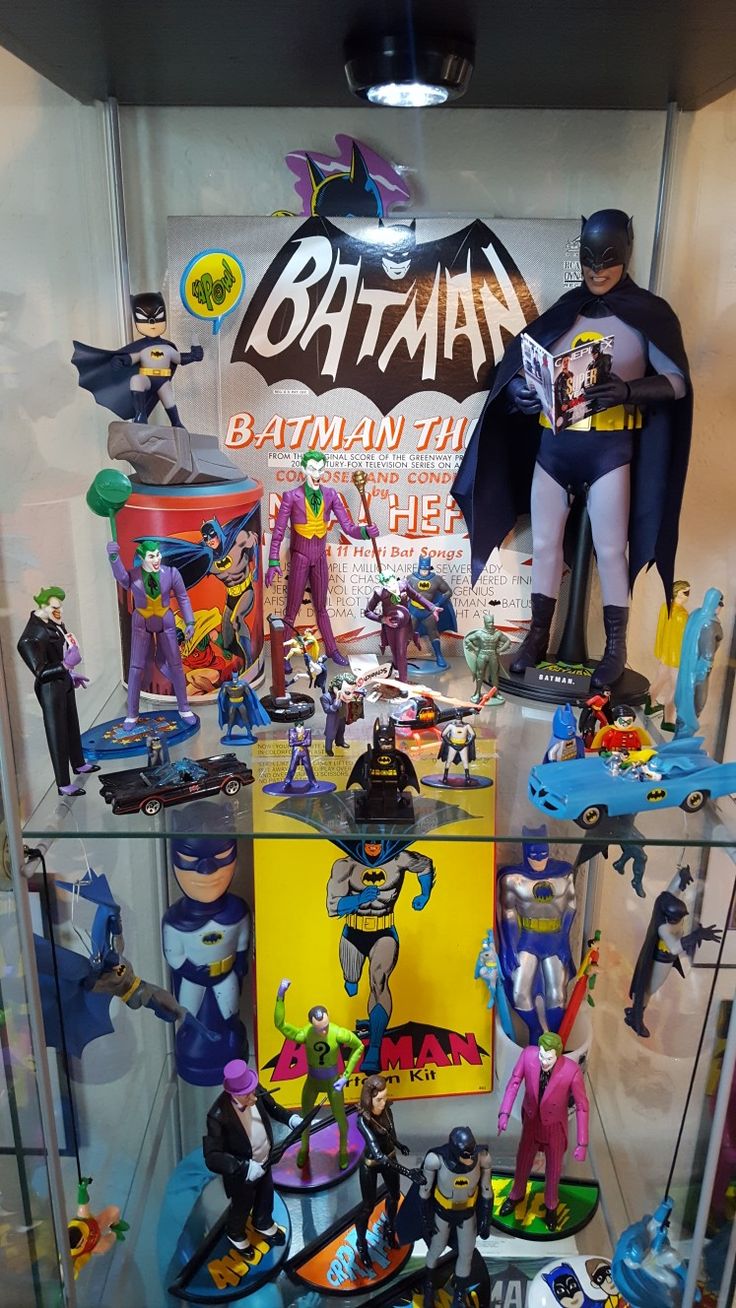 a display case filled with batman figurines and toys