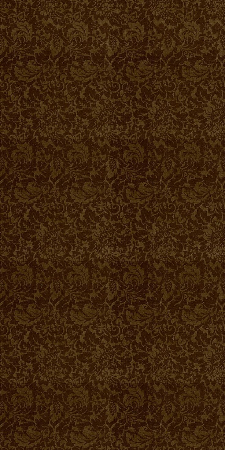 an image of a brown wallpaper with floral designs on the bottom, and dark brown background