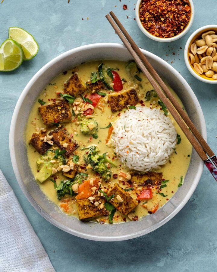 a bowl filled with rice, meat and vegetables