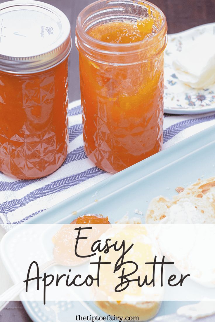 two mason jars filled with apricot butter sitting on top of a white plate