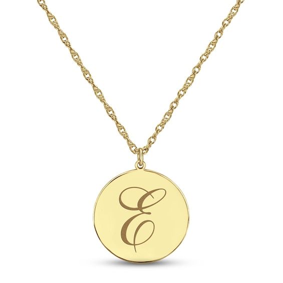 Pretty and personalized, this 10K yellow gold necklace features a disc inscribed with your initial in an elegant script font. The pendant suspends from an 18-inch rope chain that secures with a spring ring clasp. Formal Yellow Gold Name Necklace With Initial Pendant, Engraved Yellow Gold Initial Necklace For Formal Occasions, Formal Engraved Yellow Gold Initial Necklace, Yellow Gold Monogram Initial Necklace, Formal Engraved Initial Pendant Name Necklace, Engraved Yellow Gold Initial Medallion Necklace, Yellow Gold Name Necklace With Round Pendant, Engraved Yellow Gold Round Disc Initial Necklace, Elegant Personalized Coin Necklace With Initial Pendant