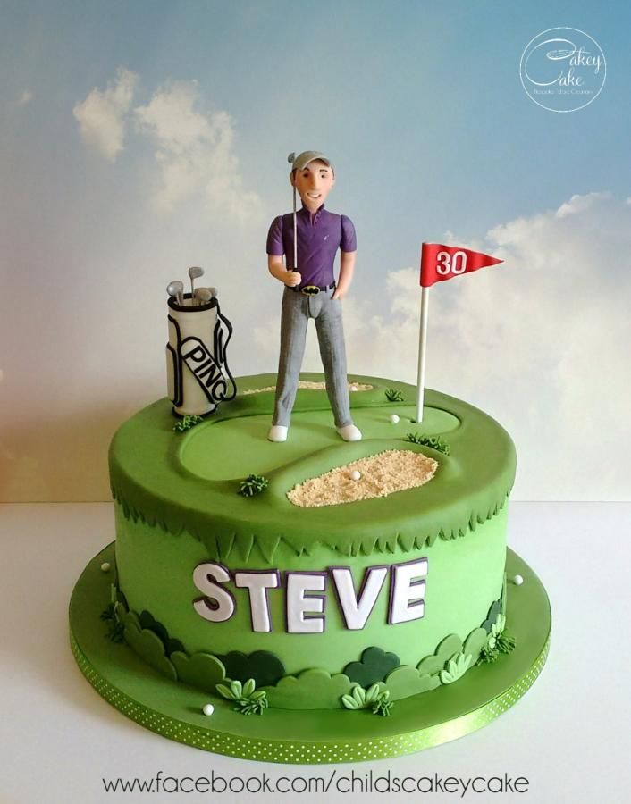 a green cake with a golf player on top