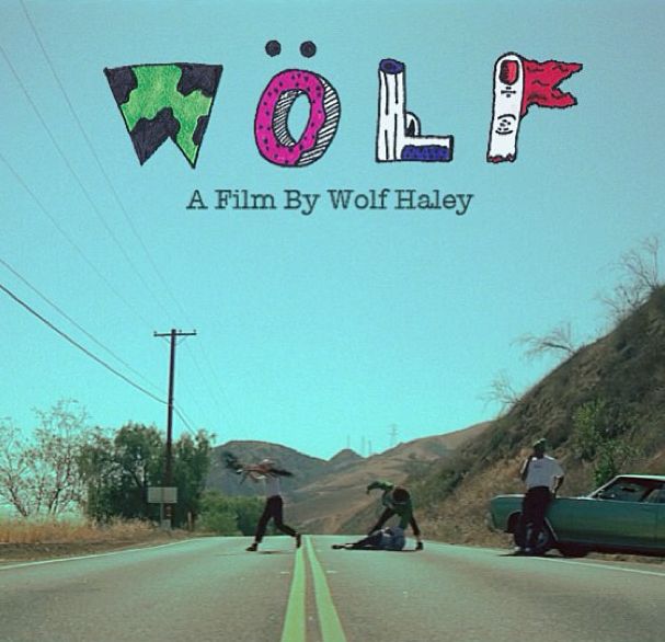 the movie poster for wolf is shown with people on the side of the road and an old car