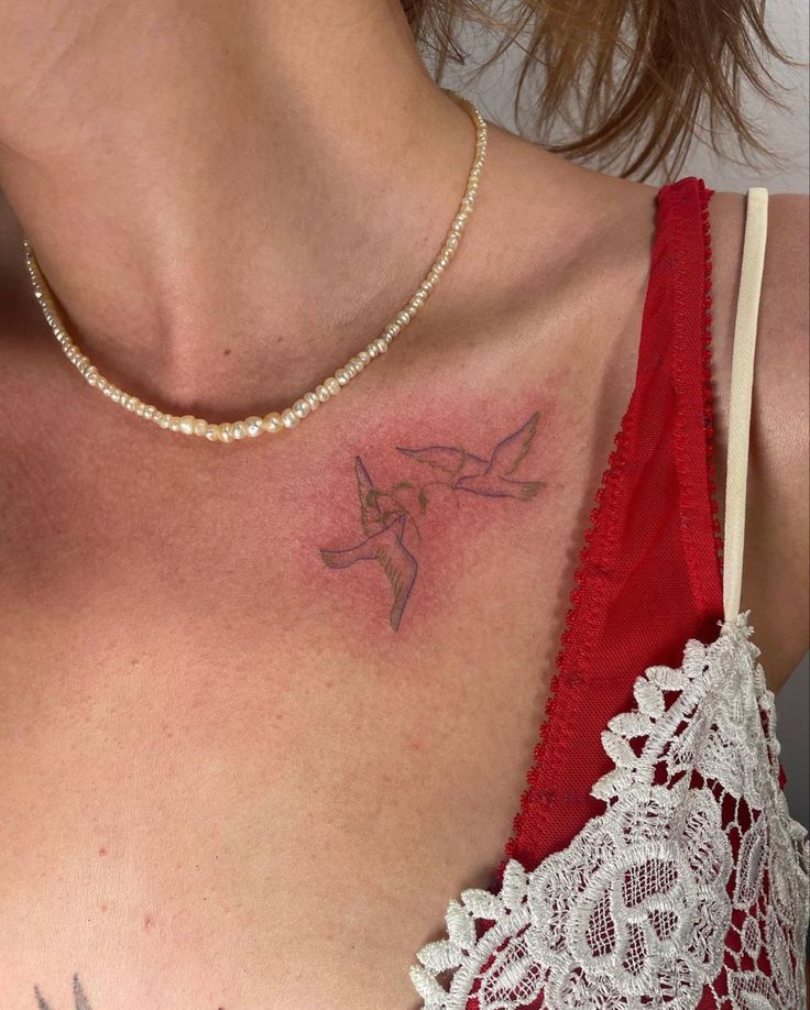 a woman with a tattoo on her chest