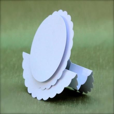 three pieces of paper are stacked on top of each other in the shape of an oval