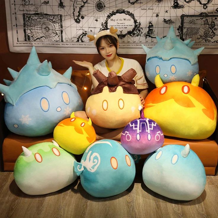 a woman sitting on a couch surrounded by stuffed animals and other items in various colors