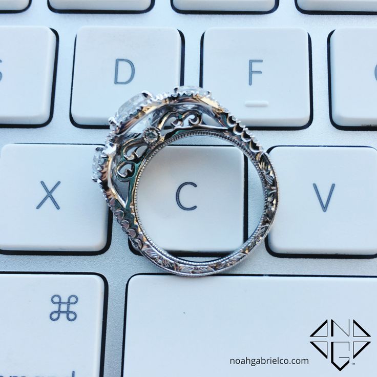 a ring sitting on top of a computer keyboard