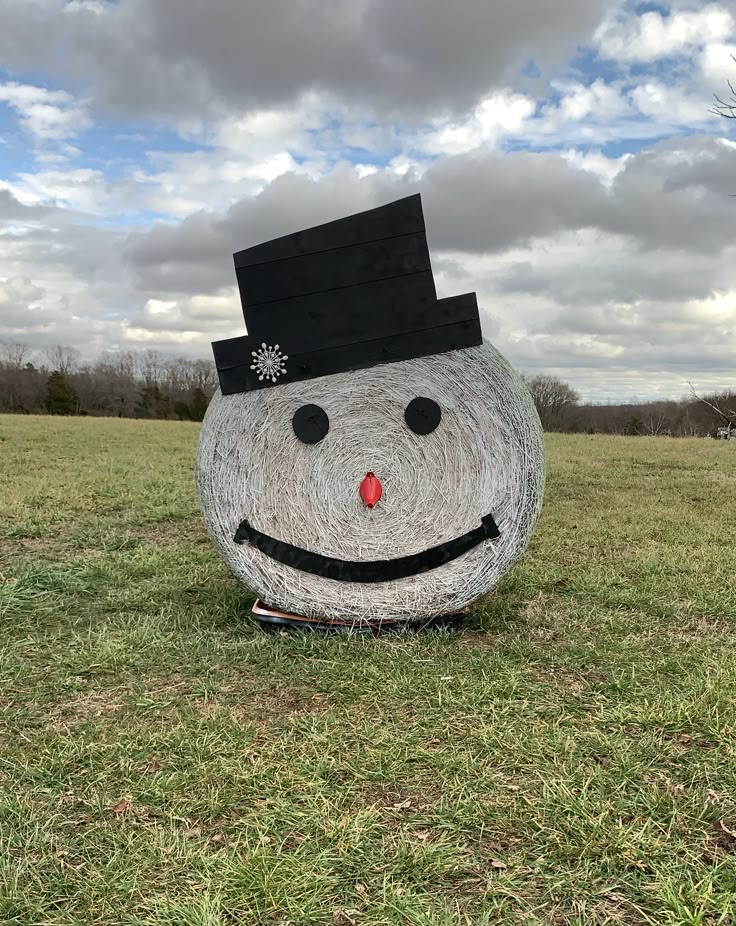 a large rock in the shape of a snowman with a hat on it's head