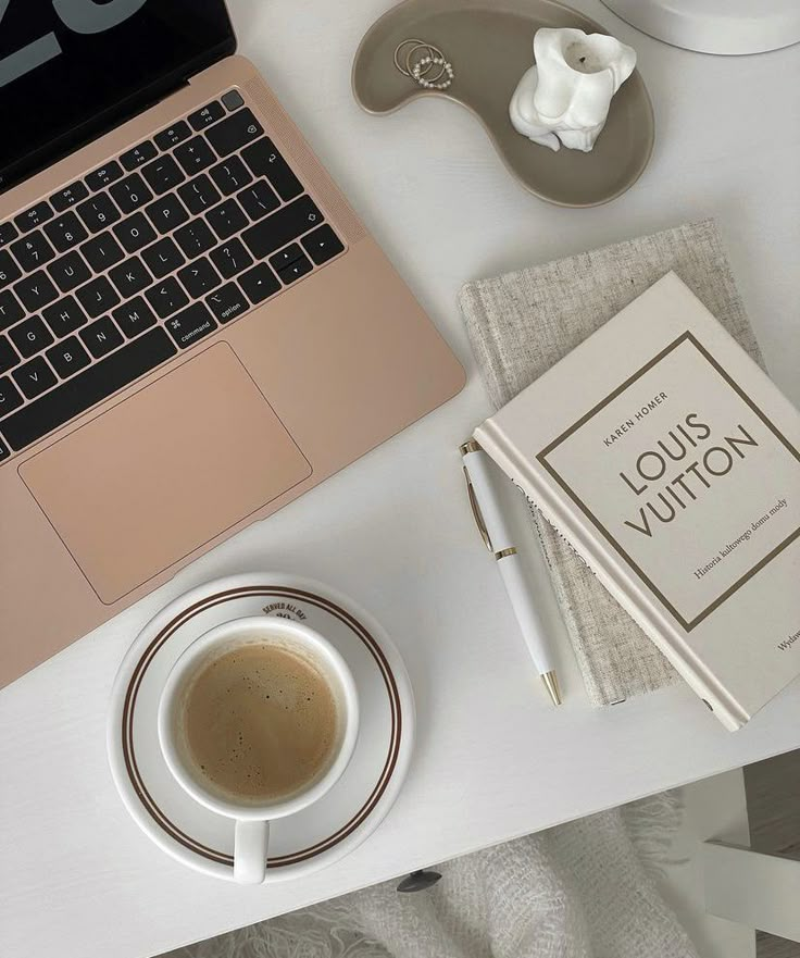 A birds eye view of a desk with two note books, a pen, a cup of coffee, and a laptop. Home Office Beige Aesthetic, Macbook Office Aesthetic, Work Beige Aesthetic, Macbook And Coffee Aesthetic, Work From Home Aesthetic Wallpaper, Beige Business Aesthetic, Computer And Coffee Aesthetic, Macbook Gold Aesthetic, Promotion Aesthetic Work