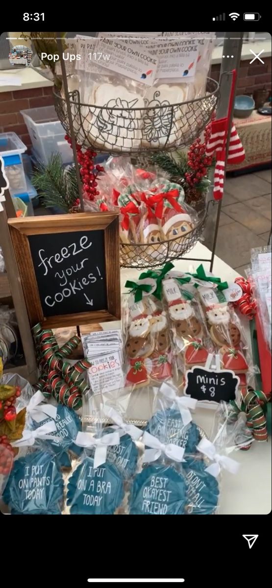 a table topped with lots of different types of cookies and candies next to a sign that says send message