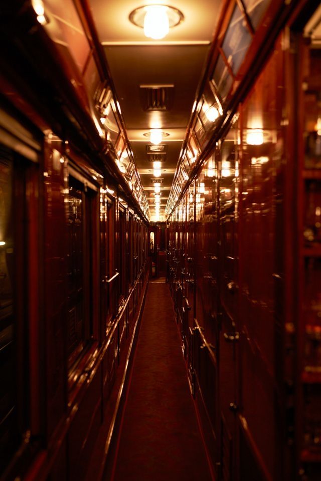 an empty train car with lots of lights on it's ceiling and doors open