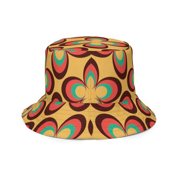 Get ready for summer with this retro vintage floral reversible bucket hat! Made from a unique linen feel fabric, this mid century modern daisy bucket hat is perfect for fun under the sun. With two sides to choose from, it's equal parts stylish and practical. Featuring a burnt orange, green and yellow floral pattern, it adds the perfect boho touch to any outfit. Enjoy days at the beach, brunch with friends, outdoor adventures or just lazing around in your garden - all while looking amazing! Get y Retro Yellow Bucket Hat For Spring, Retro Wide Brim Sun Hat For Summer, Retro Adjustable Bucket Hat For Summer, Retro Multicolor Bucket Sun Hat, Adjustable Retro Bucket Hat For Summer, Retro Wide Brim Bucket Hat, Retro Brown Hats For Spring, Retro Brimmed Sun Hat For Vacation, Retro Brimmed Sun Hat For Summer