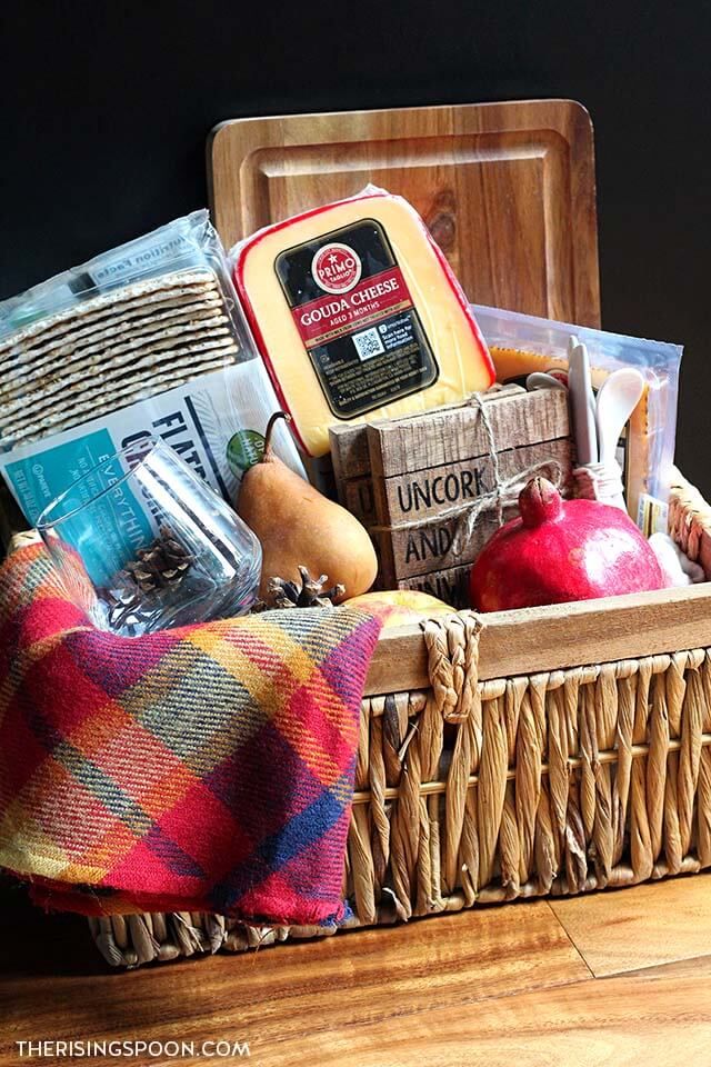 a basket filled with food sitting on top of a wooden floor