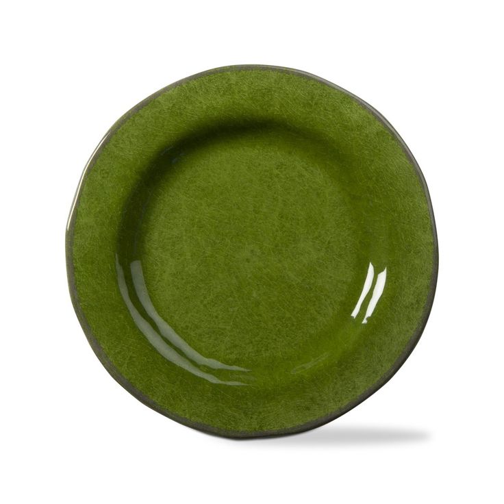 an empty green plate on a white background